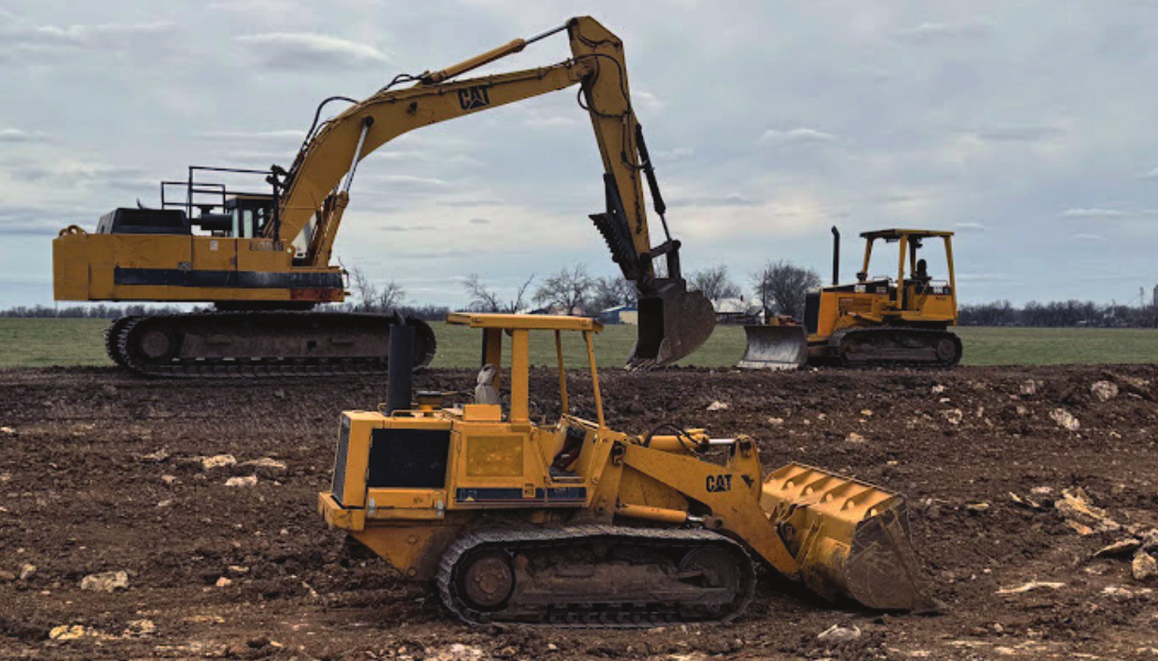 Back side of Summy Excavating business card showing excavator, dozer, pad sites, pond cleaning, general dozer work, and pond and lagoon construction
